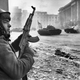 Romanian soldier taking cover during a battle between the army and pro-Ceausescu supporters in Bucharest on Dec. 24, 1989.